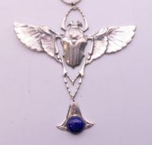 A sterling silver Egyptian Revival scarab beetle pendant on chain. The pendant 9.5 cm high.