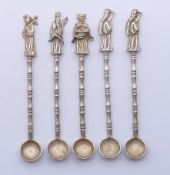 Five Chinese white metal spoons, each with figural finial. Each approximately 10.5 cm high.