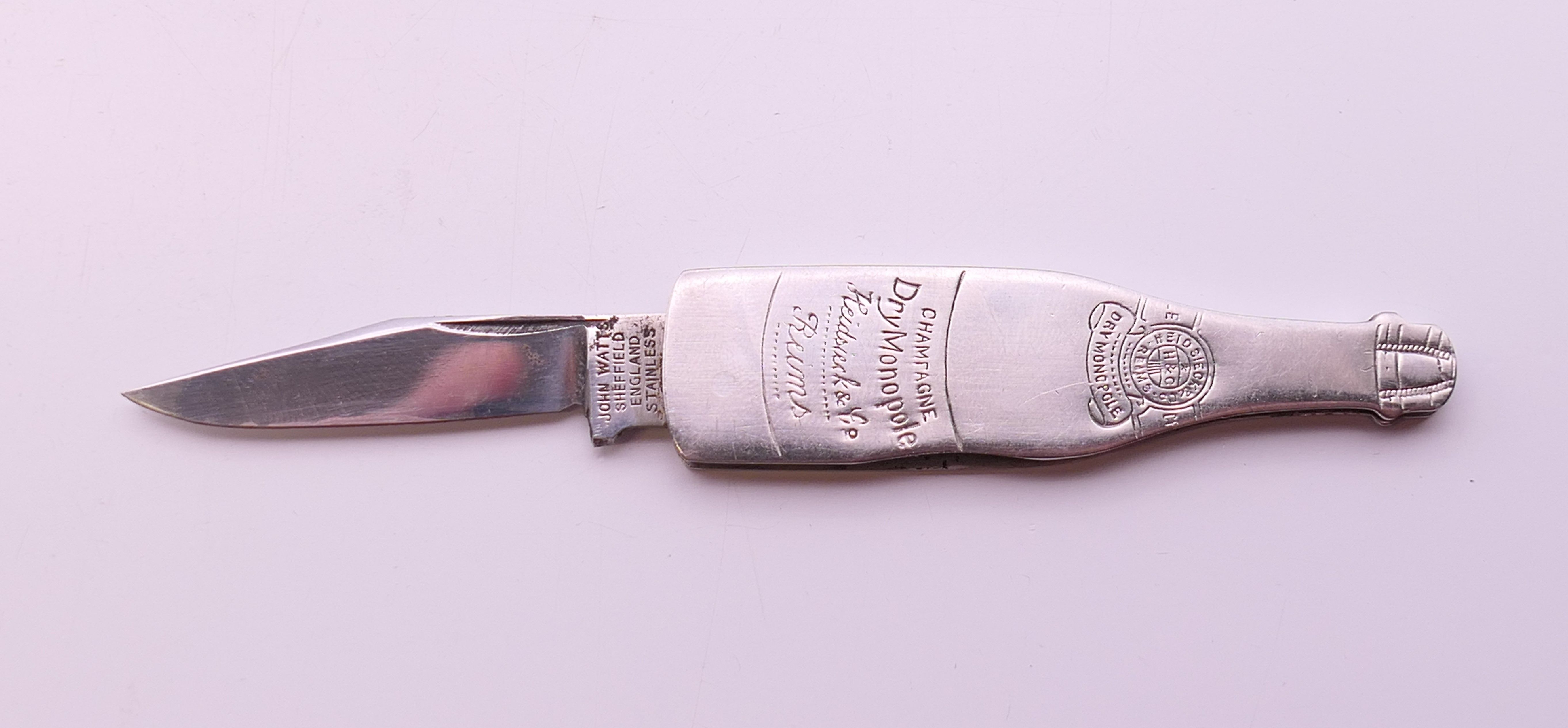 A novelty penknife formed as a champagne bottle. 6.5 cm high. - Image 5 of 5