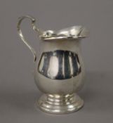 A silver cream jug. 10.5 cm high. 141.4 grammes.