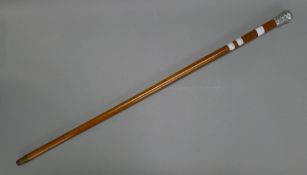 A silver mounted malacca cane decorated with Suffolk Regiment 4th Battalion insignia,