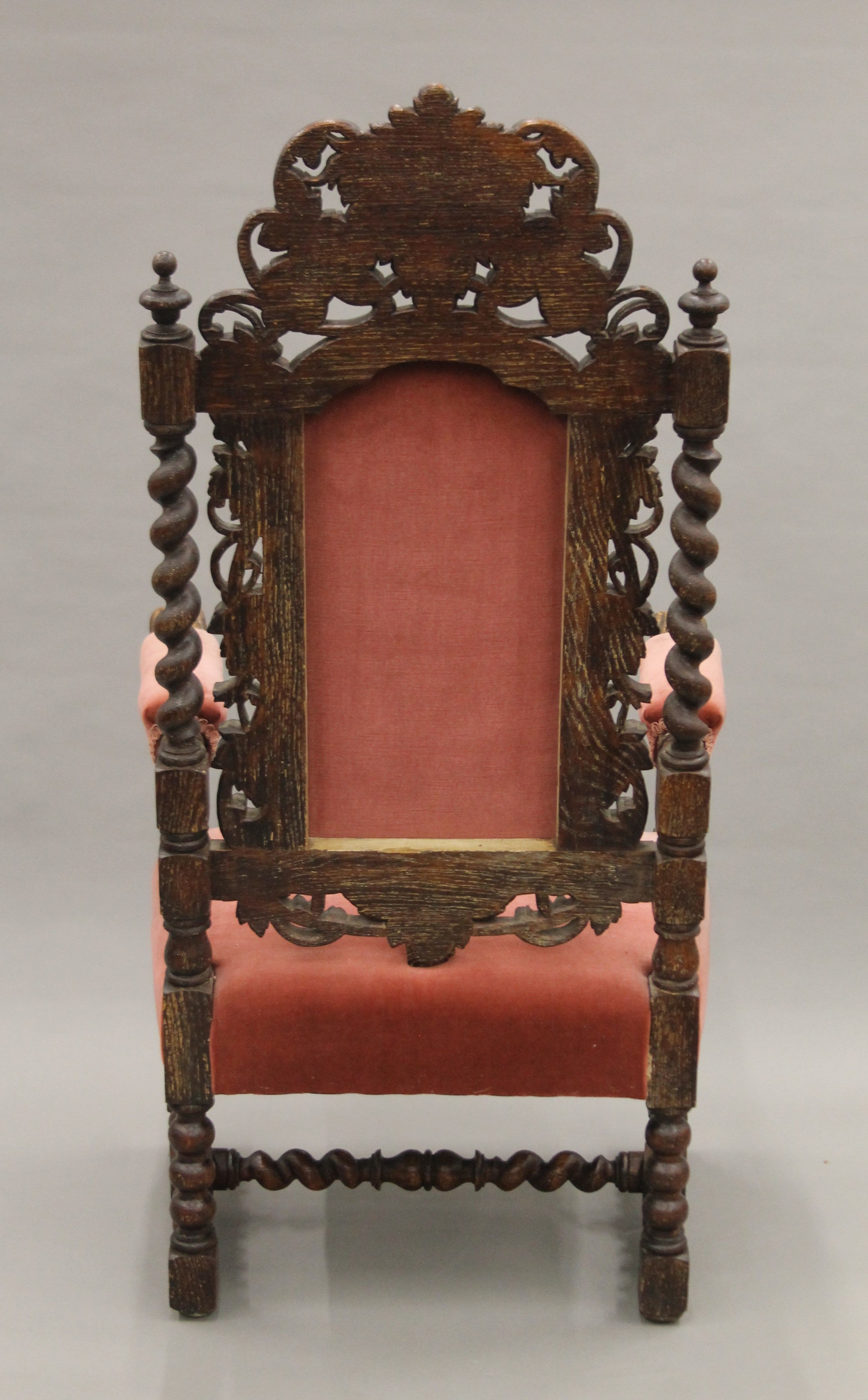 A 19th century carved oak upholstered open armchair with greenman back and dolphin form arms. - Image 7 of 7