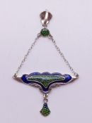 An Art Nouveau style sterling silver pendant. 6.5 cm high overall.