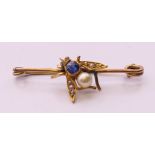 An unmarked gold bar brooch formed as a fly. 3.75 cm wide. 2.8 grammes total weight.