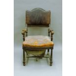 A 19th century mahogany leather upholstered open armchair, with label to webbing for Elephant Brand,