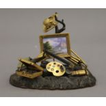 A 19th century Swiss gilt bronze and enamel sculpture, formed as various artists equipment,