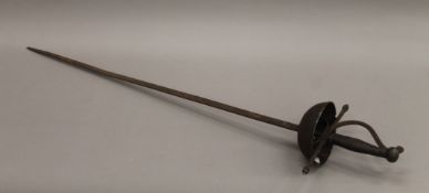 A basket-hilt sword. 95 cm long.