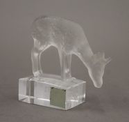 A Lalique glass model of a deer. 8 cm high.
