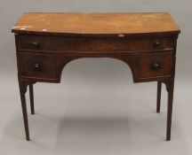 A 19th century mahogany bow front side table. 98.5 cm wide.