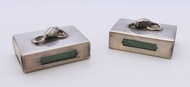 Two silver matchbox holders. 4 cm long.