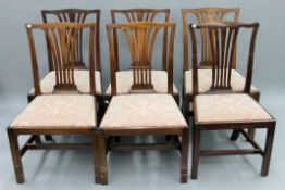 A Victorian harlequin set of mahogany dining chairs.