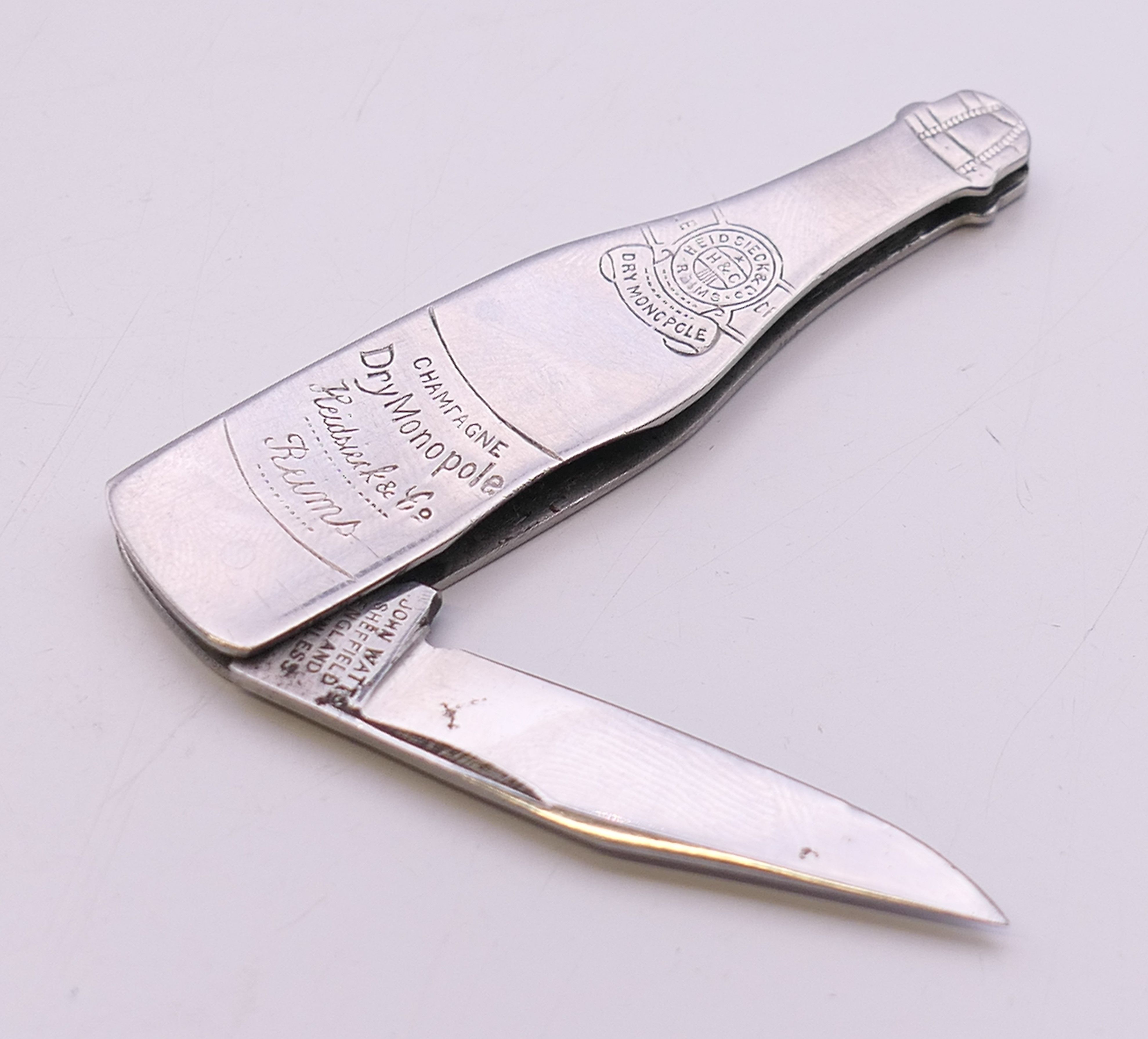 A novelty penknife formed as a champagne bottle. 6.5 cm high. - Image 3 of 5