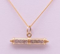 A 9 ct gold diamond set T-bar on a 9 ct gold chain. Bar 2.5 cm long, chain 41 cm long. 3.