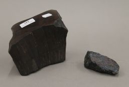 An Iron Ore specimen and a Peacock Ore specimen. The former 19 cm wide.