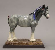 A boxed Royal Doulton Sporting and Ceremonial Horse Collection Clydesdale. 21.5 cm long.