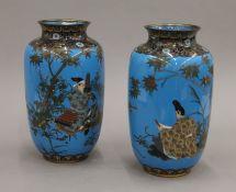 A pair of late 19th/early 20th century Japanese cloisonne vases each decorated with a scholarly