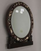 A Chinese mother-of-pearl inlaid strutt mirror. 38 cm high.
