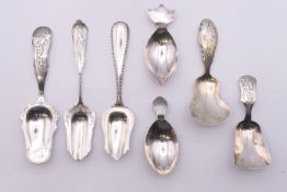 Seven Continental silver caddy spoons. The largest 12 cm long. 66.2 grammes.