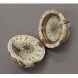 A bone globe compass. 7 cm high.