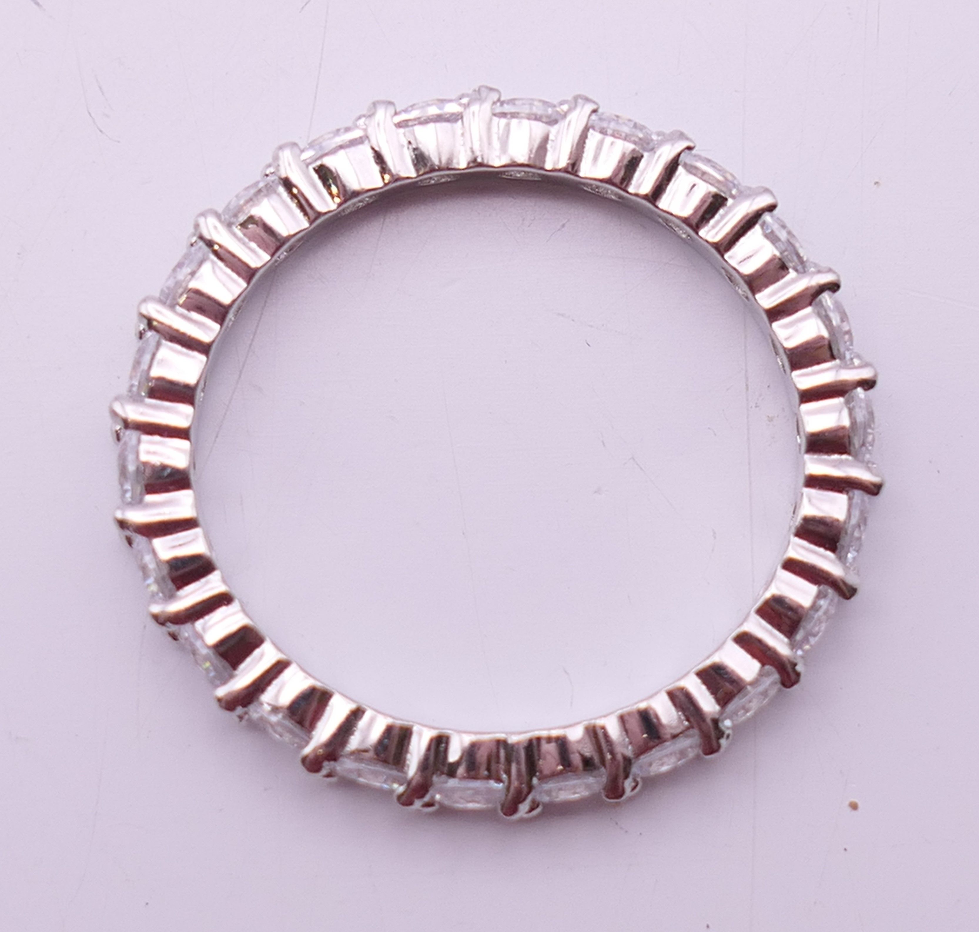 A silver and cubic zirconia full eternity ring. Ring size U. - Image 5 of 5