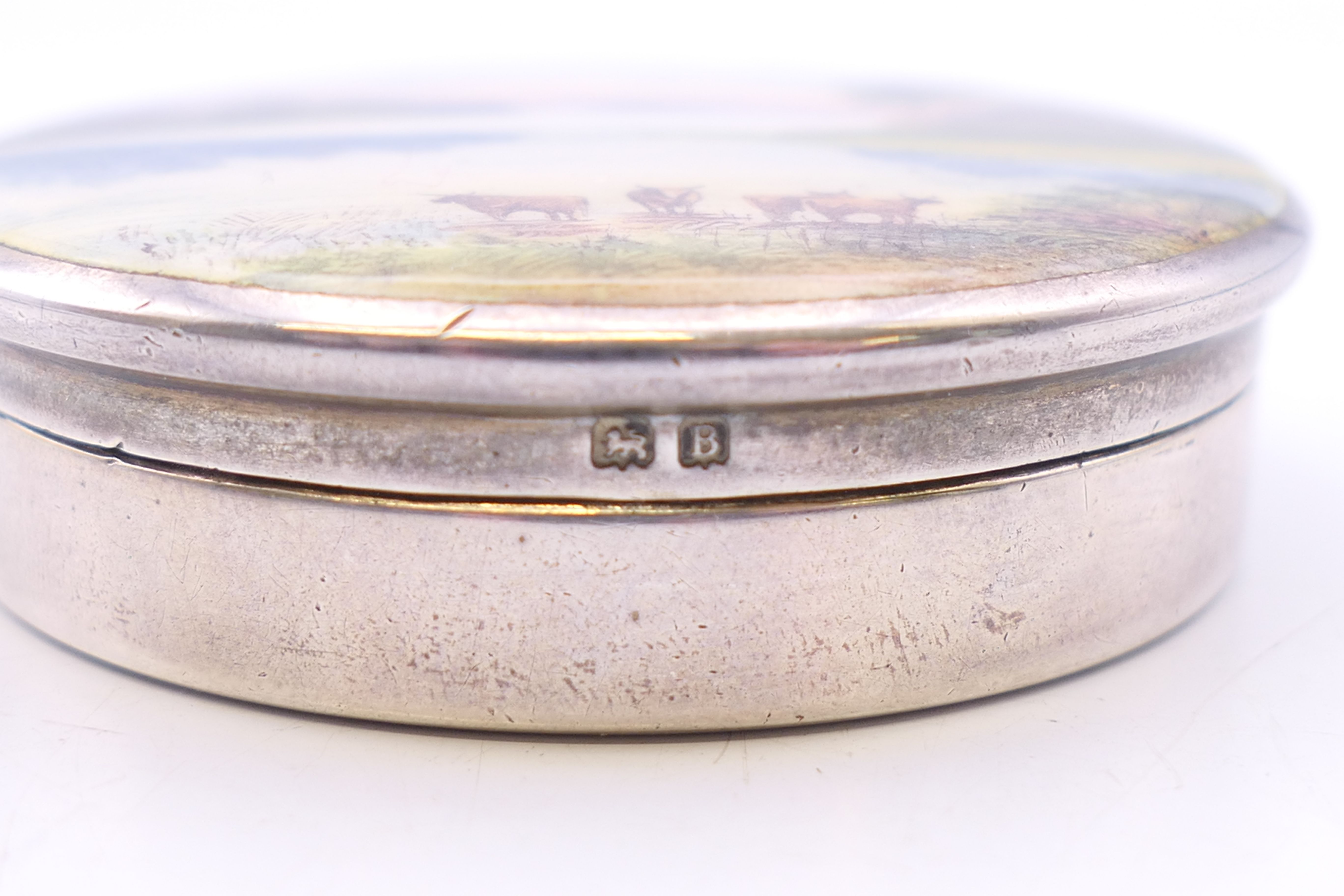 A silver and enamel pill box decorated with cattle in a mountainous landscape, - Image 3 of 7
