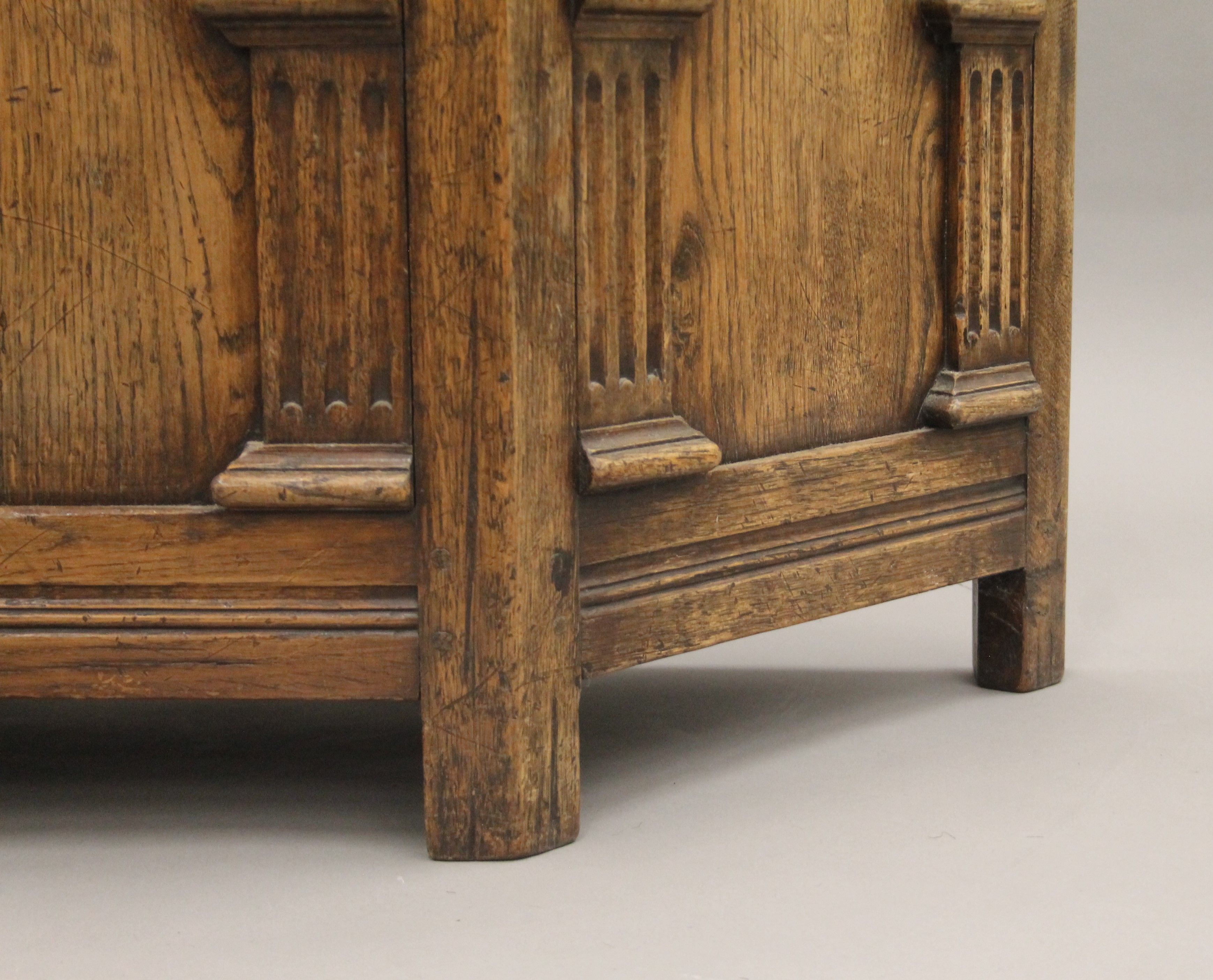 A carved oak canted corner trunk. - Image 5 of 6