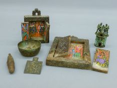 A quantity of various travelling icons, etc. The largest 12 cm wide.