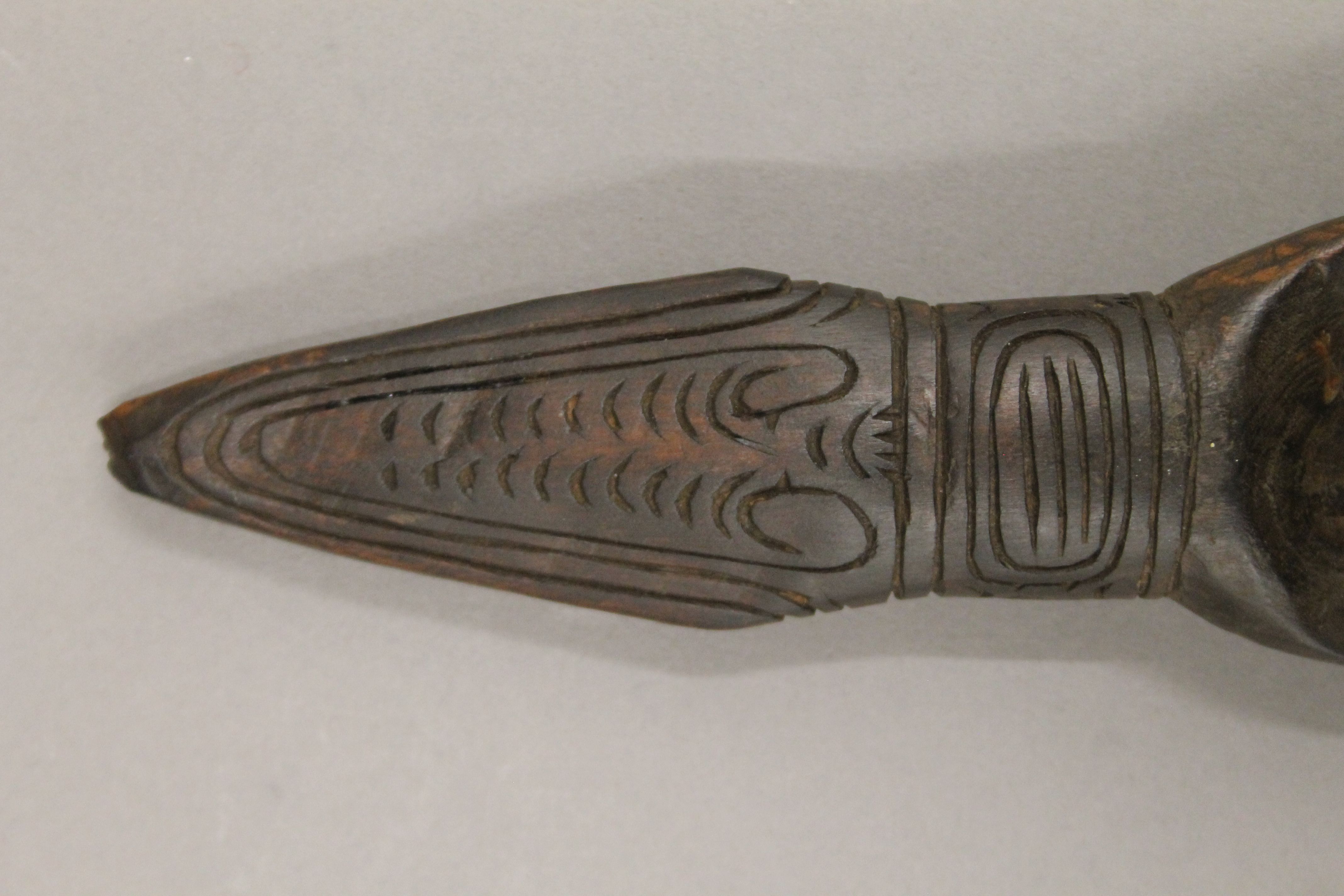 A South Seas carved wooden spoon. 23.5 cm long. - Image 2 of 3