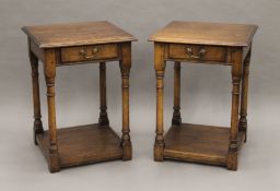 A pair of oak side tables, each with single drawer. 55 cm wide.