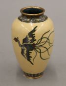 A late 19th/early 20th century Japanese cloisonne vase decorated with phoenix. 11.5 cm high.