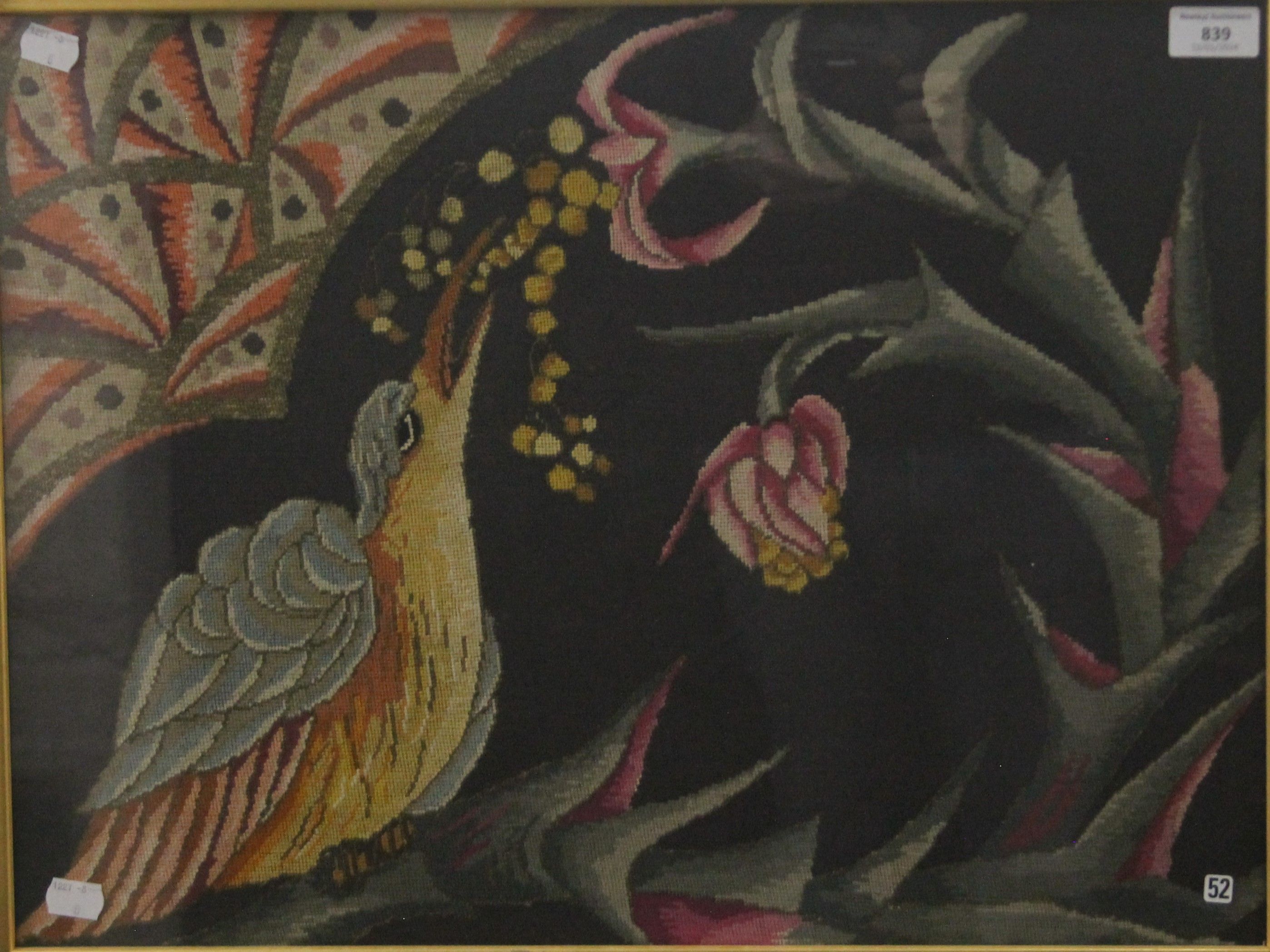 A framed and glazed needlework, Bird amongst Floral Sprays. 55 x 41.5 cm.