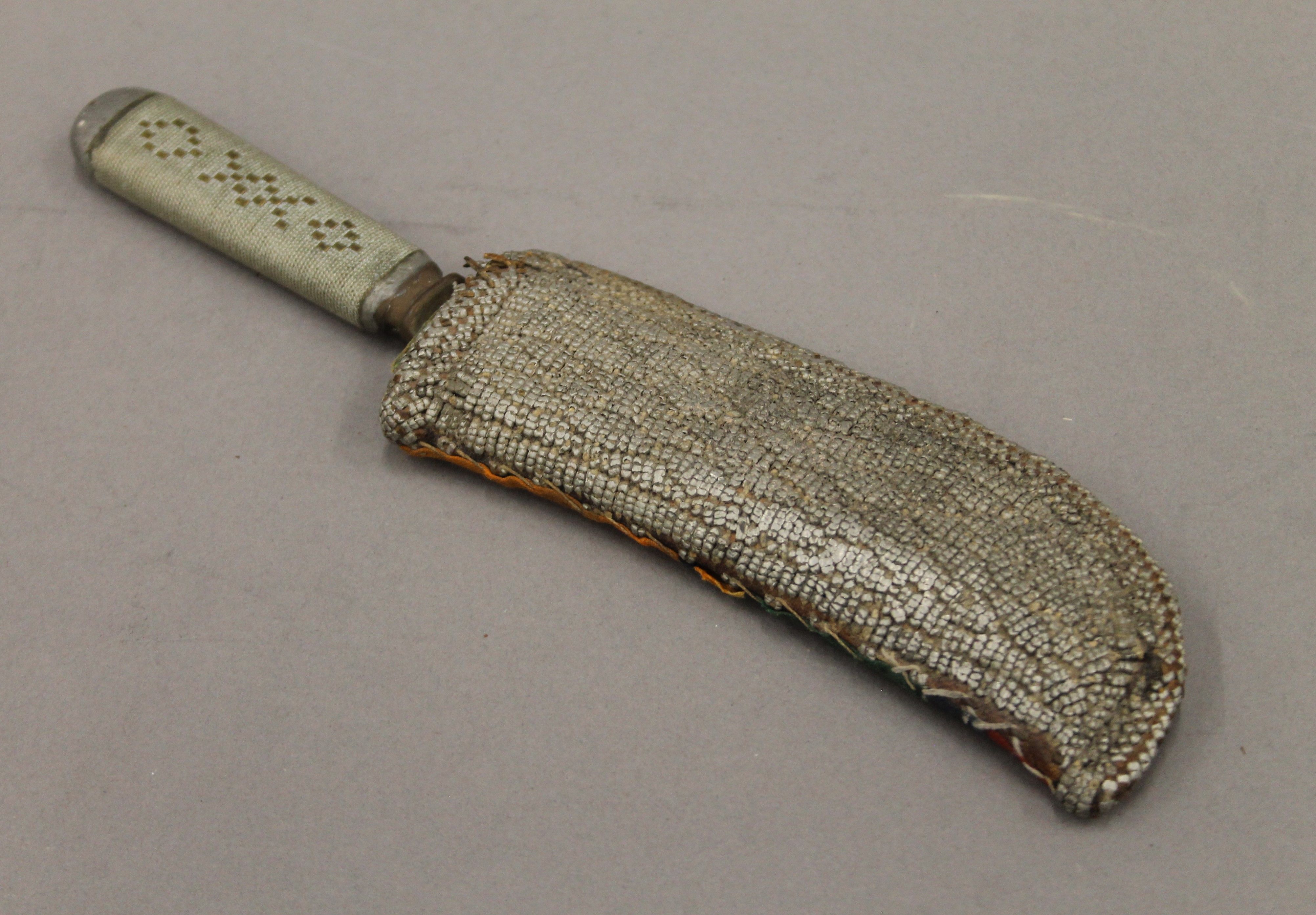 A Solingen dagger in sheath. 24 cm long.