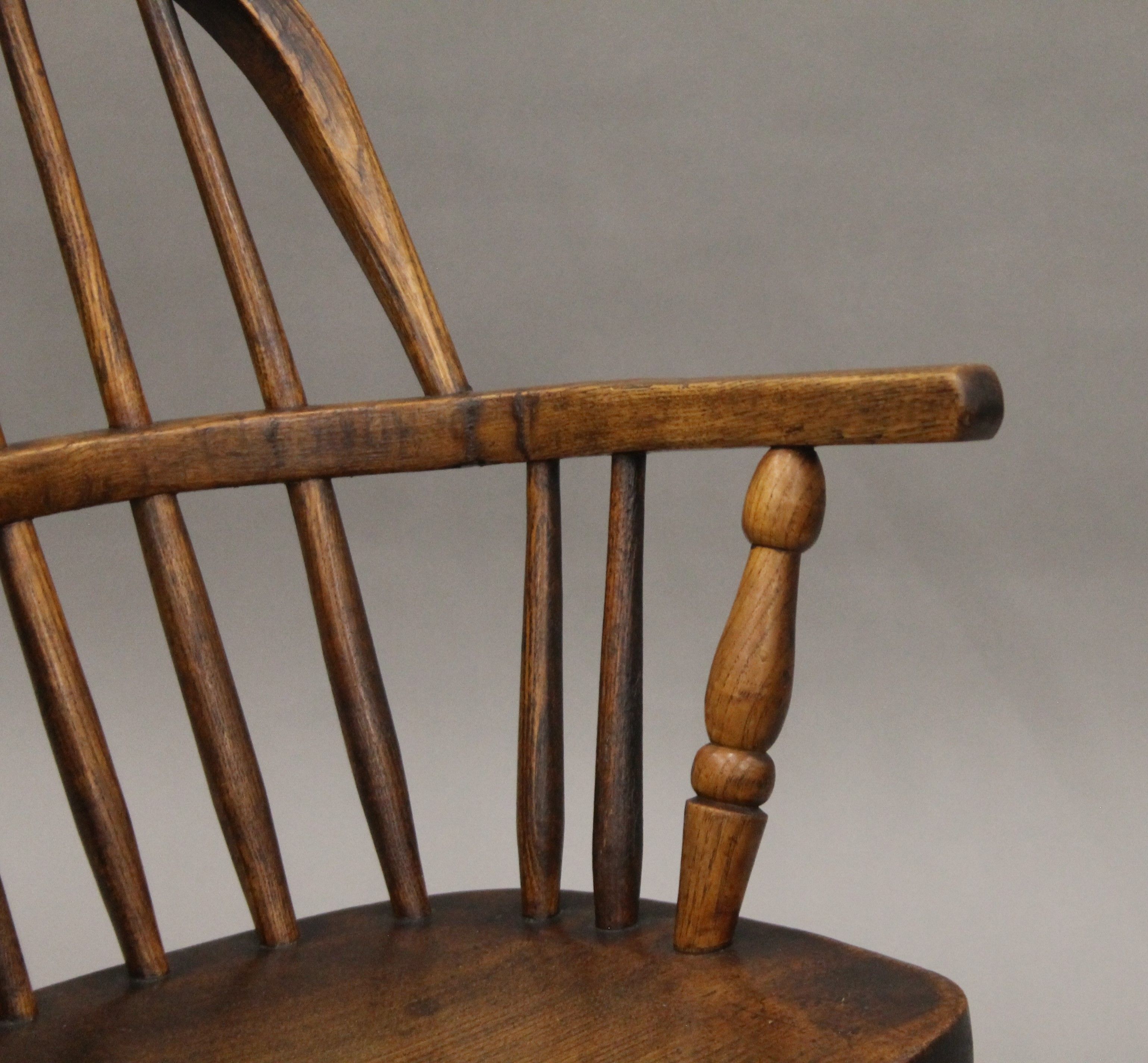 A Victorian elm child's stick back open arm rocking chair. - Image 3 of 4