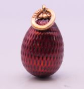 A gold mounted egg form pendant, bearing Russian marks. 2.5 cm high.