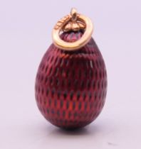 A gold mounted egg form pendant, bearing Russian marks. 2.5 cm high.