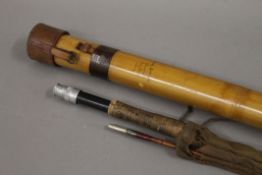 A Hardy bamboo tip tube and a Hardy Delux 9' 6'' three-piece split cane rod, with spare tip.