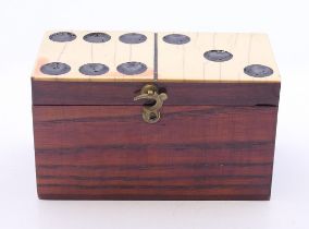 A domino box containing miniature dominoes. The box 8 cm wide.