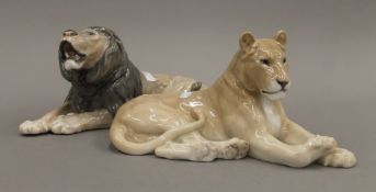 A pair of Royal Copenhagen models of a lion and lioness. The former 34.5 cm long.