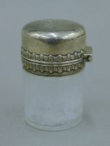 A Tiffany & Co silver topped dressing table jar. 8.5 cm high.