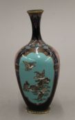 A late 19th/early 20th century Japanese cloisonne vase decorated with vignettes of birds and floral