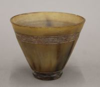 A horn cup. 9.5 cm high.