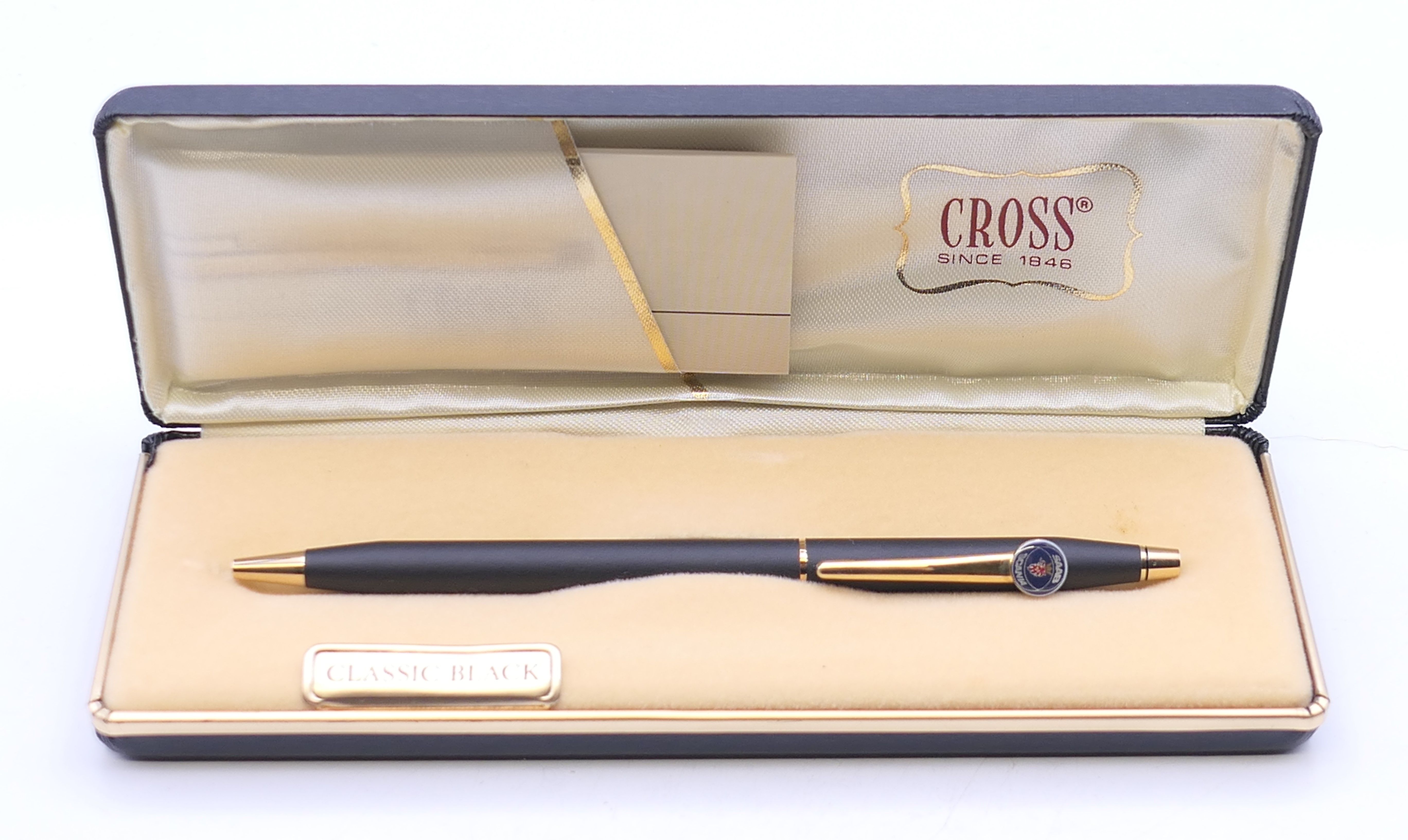 A boxed Cross Saab pen.