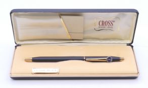 A boxed Cross Saab pen.