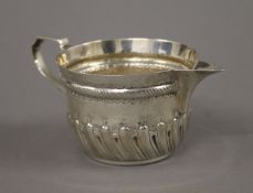 A Victorian silver cream jug. 6 cm high. 120.1 grammes.