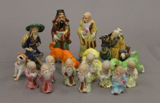 A quantity of small Oriental porcelain figures and animals. The largest 10.5 cm high.