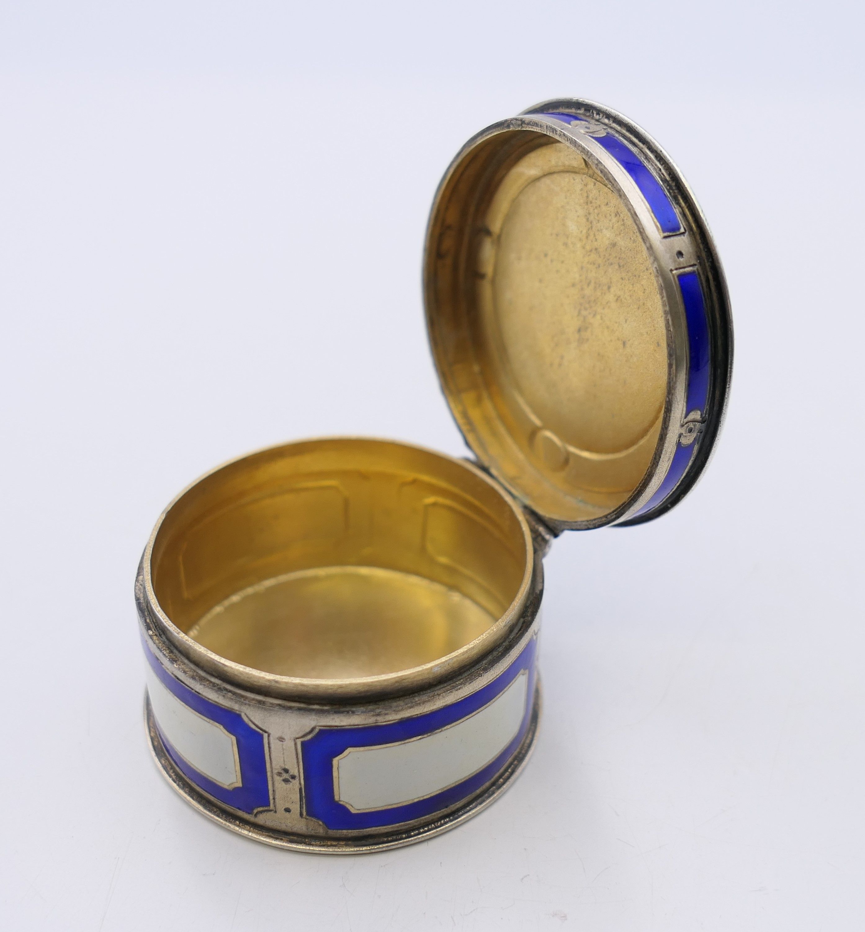 A Continental 800 silver and enamel pill box, the lid decorated with a courting couple. 4. - Image 7 of 8