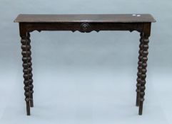 A Victorian oak bobbin twist hall table. 109 cm long.