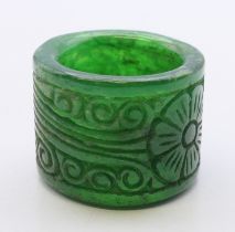 A carved jade archer's ring. 2.25 cm high.
