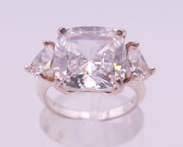 A silver cubic zirconia three stone ring. Ring size K/L.