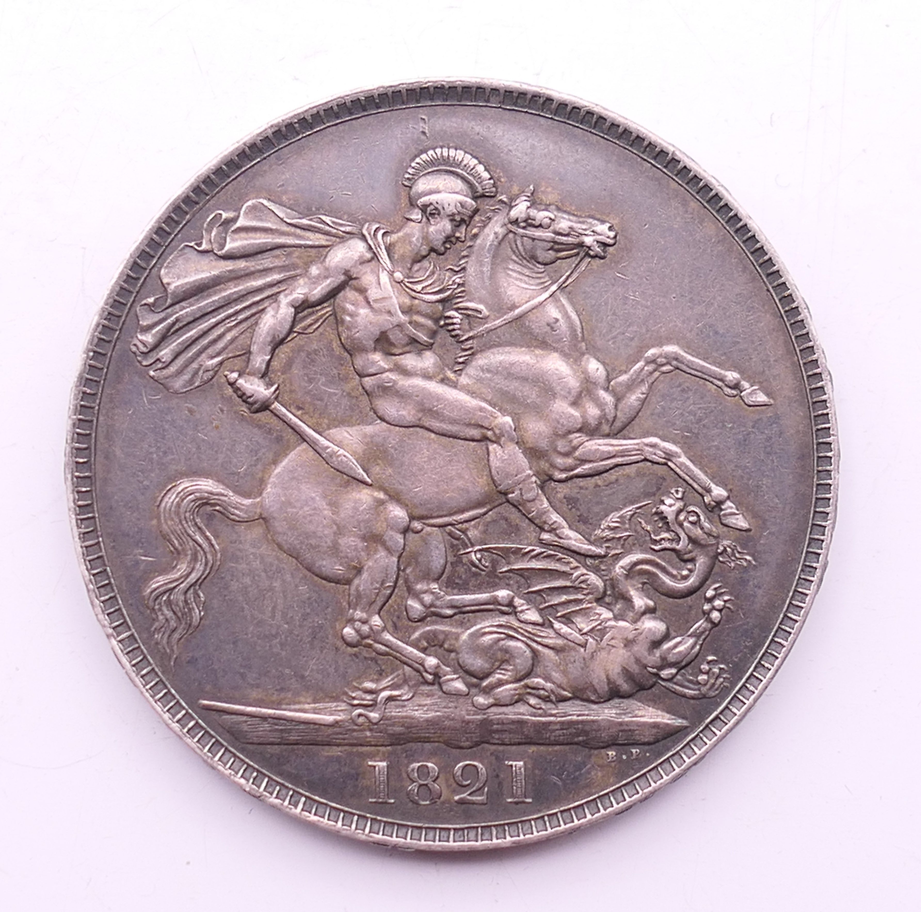 An 1821 silver crown.